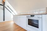 Großzügige 2-Zi DG-Wohnung, zentral gelegen mit großem Gem.Garten